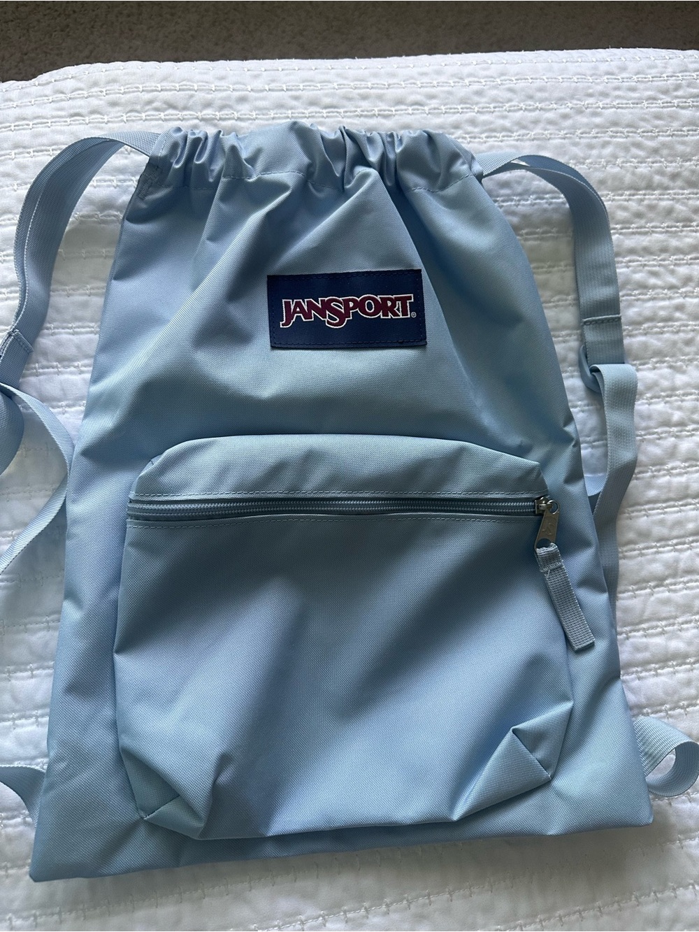 Jansport Pale Blue Drawstring Backpack with Front Zip Pocket